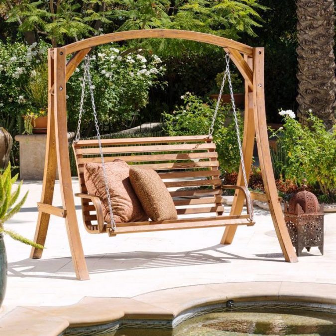 Wooden-Porch-Swing-at-Home-garden-675x675 +7 Ideas to Revamp Your Garden for 2021