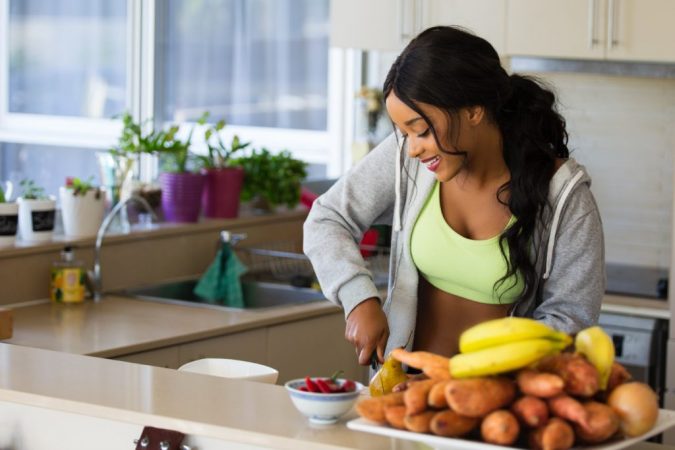 Spotlight on the Paleo Diet: Is It for You? 28 woman cooking dieter Spotlight on the Paleo Diet: Is It for You? - 28