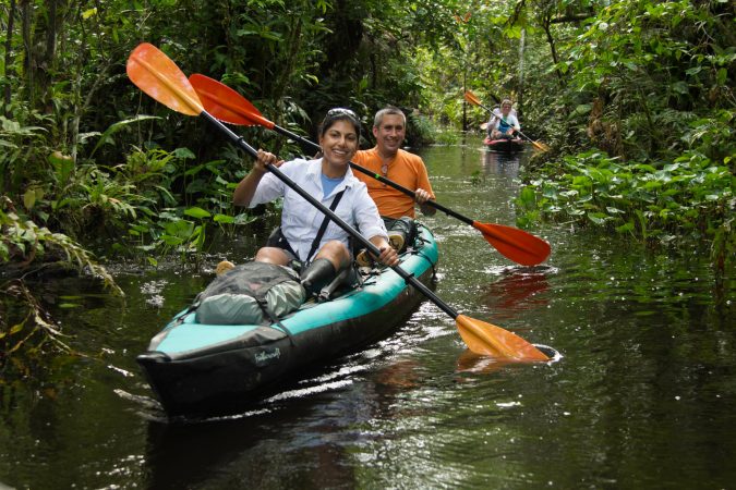 amazon kayaking tour happy couple 6 Types of Outdoor Travel Adventures to Experience - 11
