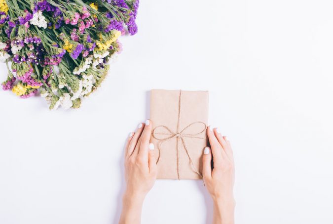 books for moms wrapped book and flowers Top 15 Creative Mother's Day Gift Ideas - 8
