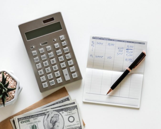 calculator calculating expenses Got Spare Money? Here Are 4 Ideas What to Do with It - 6