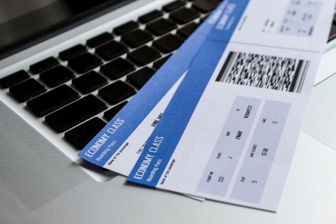 laptop flight tickets 5 Travel Tips to Help You Save (Or Gain) Money on Your Next Trip - 1