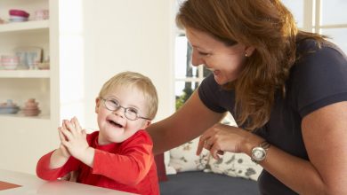 woman and child Downs Syndrome boy having speech therapy Rare Genetic Disorder: 5 Ways to Show a Family Emotional Support - 43