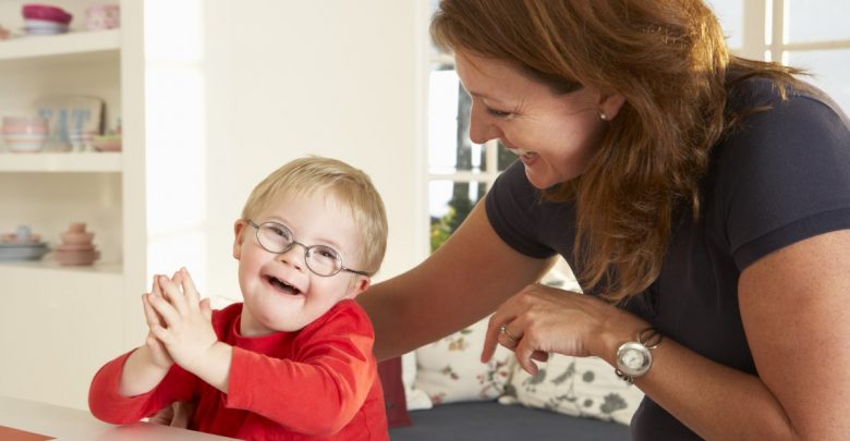 woman and child Downs Syndrome boy having speech therapy Rare Genetic Disorder: 5 Ways to Show a Family Emotional Support - Genetic disorder 1