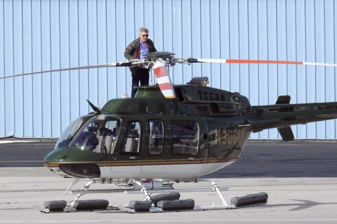 15 Most Luxurious Helicopters and Private Jets Owned by Celebrities! 45 Harrison Ford Stands on Helicopter 15 Most Luxurious Helicopters and Private Jets Owned by Celebrities! - 45