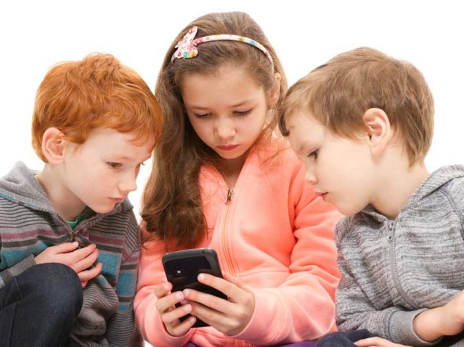 children using cell phones Top 5 Reasons to Use Cell Phone Tracker - 2