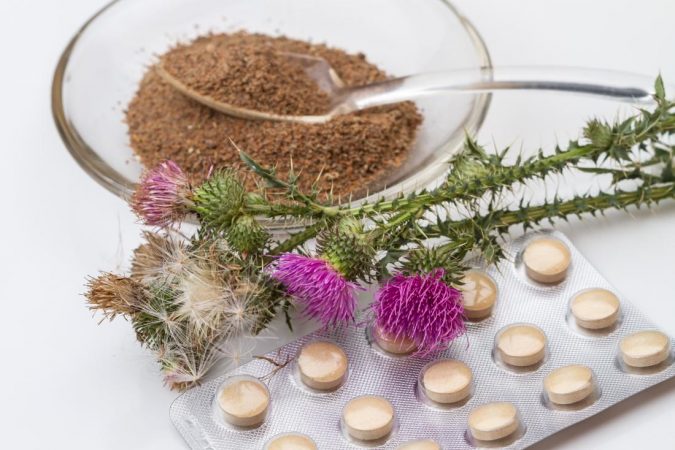 milk thistle plants with powdered extract and supplements 8 Natural Supplements You Should Add to Your Health Regimen - 15