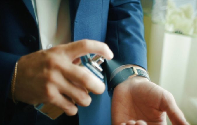 A Man's Ultimate Guide to Choosing the Best Fragrance 3 man putting perfume A Man's Ultimate Guide to Choosing the Best Fragrance - 3