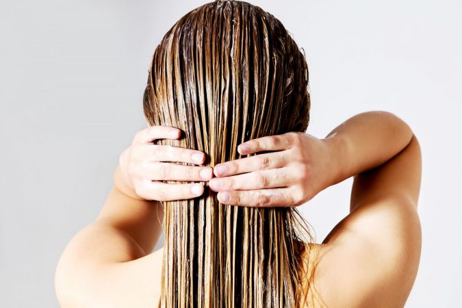 15 Natural Hair Beauty Tips for All Hair Types 24 applying hair conditioner 15 Natural Hair Beauty Tips for All Hair Types - 24
