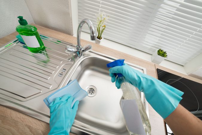 cleaning kitchen sink 1 6 Most Essential Things in Your Home to Keep Clean - 7
