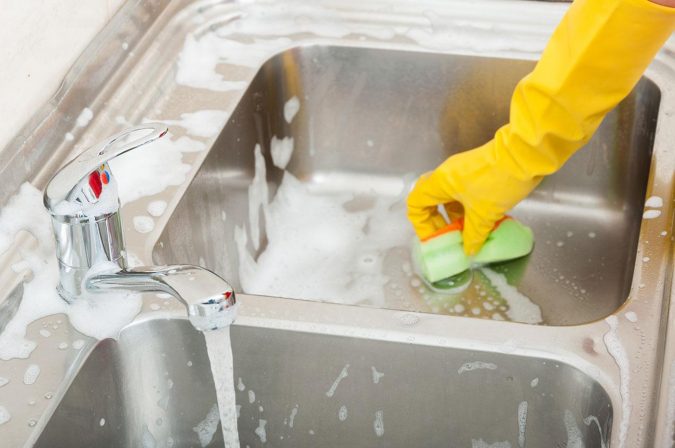 cleaning kitchen sink 6 Most Essential Things in Your Home to Keep Clean - 6