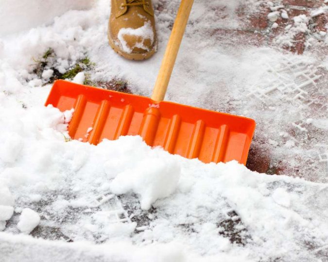 shoveling snow 3 Reasons Why You Need a Snow Blower - 3