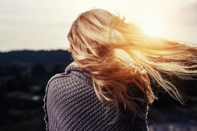 15 Natural Hair Beauty Tips for All Hair Types 7 woman enjoying sunlight 15 Natural Hair Beauty Tips for All Hair Types - 7