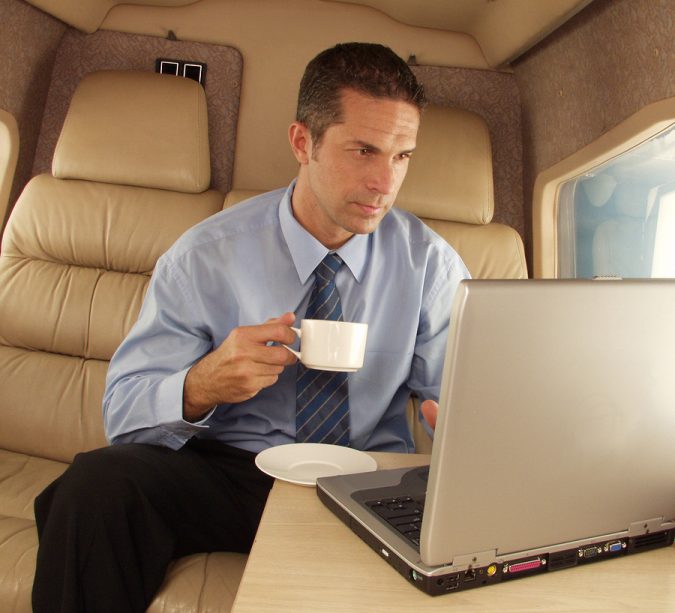 Businessman-working-at-privat-jet-675x613 5 Benefits of Renting a Private Jet