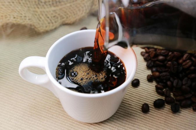 Best Nootropics to Improve Your Brain Power 3 caffeine in coffee poured into cup coffee beans Best Nootropics to Improve Your Brain Power - 3