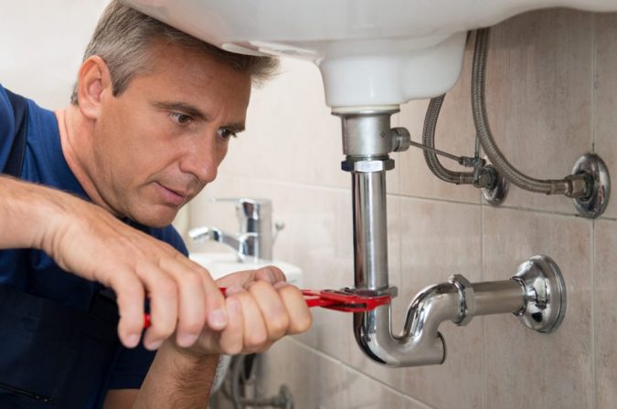 A Quick Guide on How to Choose the Best Plumber in Your Area 3 plumber working A Quick Guide on How to Choose the Best Plumber in Your Area - 3