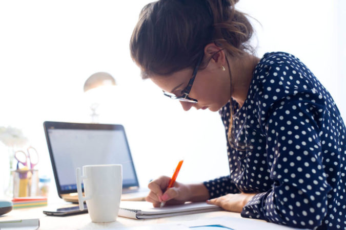laptop woman working 10 Signs that You Need an Online Therapist Help - 6