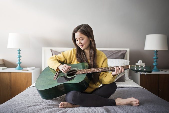 palying guitar 10 Signs that You Need an Online Therapist Help - 19