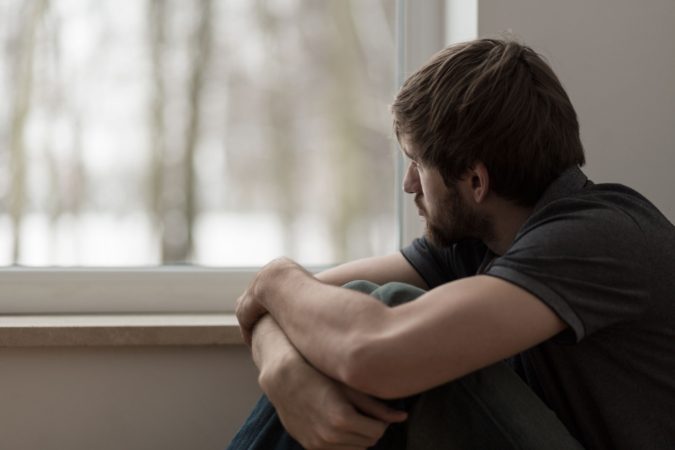 sad man grief 10 Signs that You Need an Online Therapist Help - 13