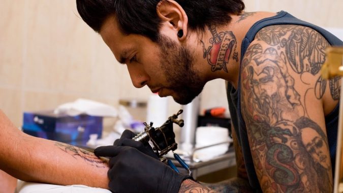 tattoo-artist-675x380 What You Need to Know about Scar Cover-Up Tattoos