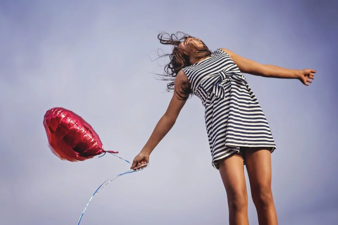 girl-holding-balloon-joy-675x450 Healthy Alternatives: Why CBD Oil Is Worth Your Time and Money