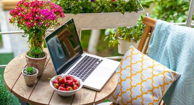 laptop working in home garden 2 Top 20 Garden Trends: Early Predictions to Adopt - 31