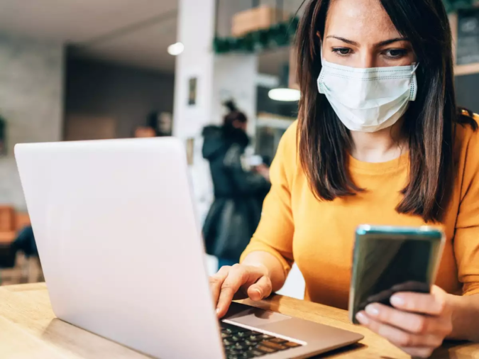 laptop working wearing mask Top 20 Work from Home Opportunities during Pandemic Times - 5