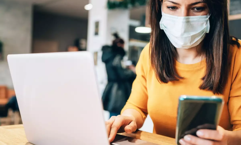 laptop working wearing mask Top 20 Work from Home Opportunities during Pandemic Times - Pandemic Times 1