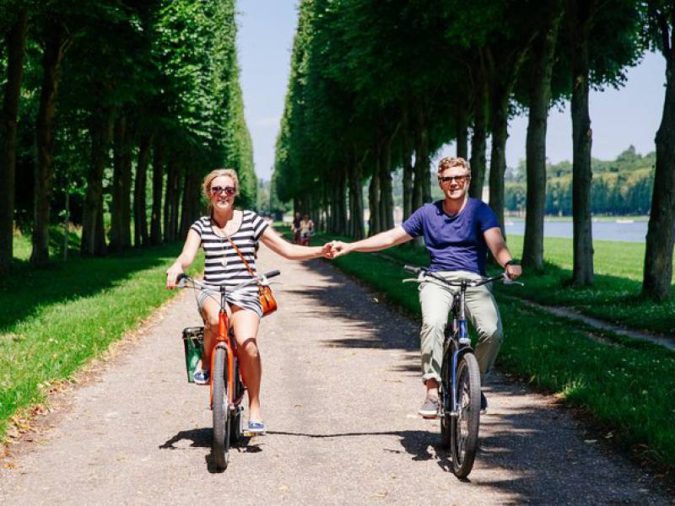 visiting-paris-riding-bikes-around-Versailles-675x506 7 Things Americans Should Know Before Visiting France