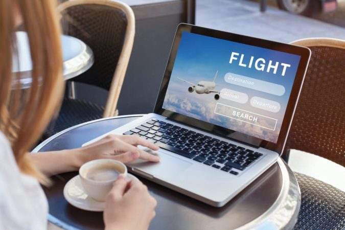 laptop-booking-flight-online-2-675x450 10 Tips to Get Best Flight Booking Deals