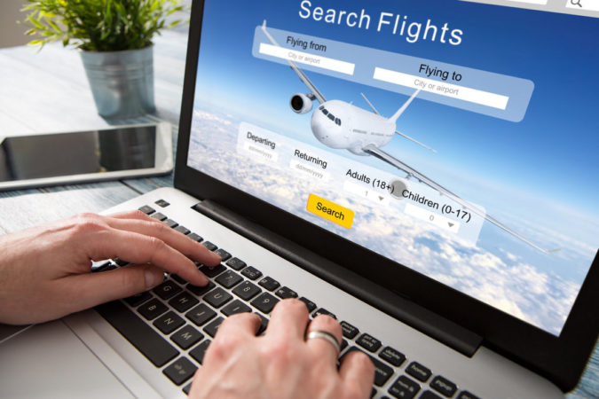 laptop-booking-flight-online-675x450 10 Tips to Get Best Flight Booking Deals