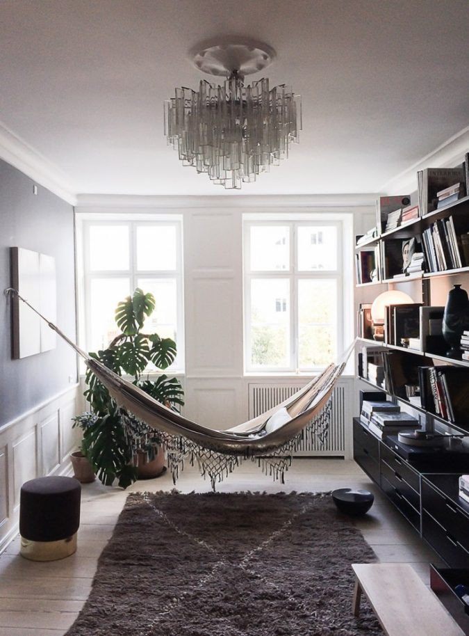 25 Stunning Interior Decorating Ideas for Sunrooms 51 sunroom with hammock and liberary 25 Stunning Interior Decorating Ideas for Sunrooms - 51