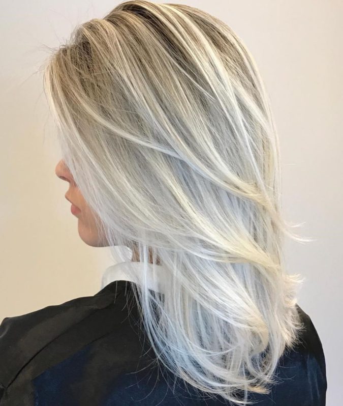 The-medium-gray-style-with-swoopy-hair-layers-675x798 15 Beautiful Gray Hairstyles that Suit All Women Over 50