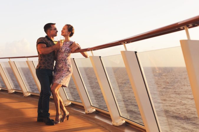 couple standing on cruise ship Falling Off a Cruise Ship: More Common Than You May Think - 1