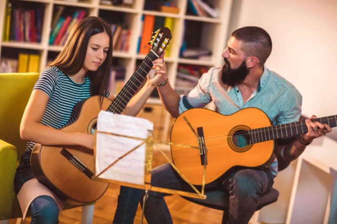 Best Side Jobs for Immigrants and International Students 7 teaching music Best Side Jobs for Immigrants and International Students - 7