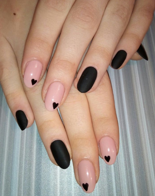tiny black hearts on pink nails