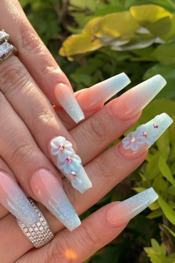 3D acrylic nails with white flower designs