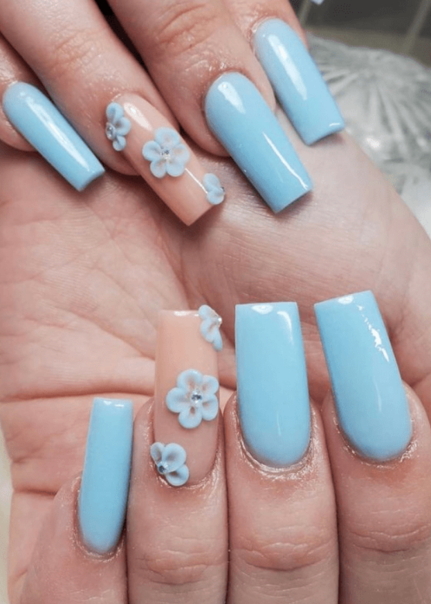 3D acrylic nails with light blue flower designs