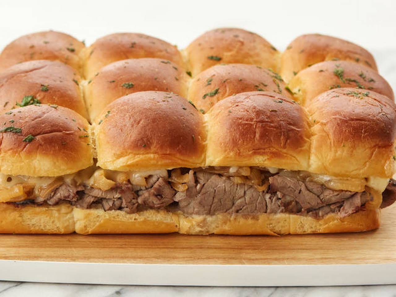 Best Christmas Snack Recipes for Easy Holiday Celebrations 12 Mini Roast Beef Sliders with Caramelized Onions Best Christmas Snack Recipes for Easy Holiday Celebrations - 12