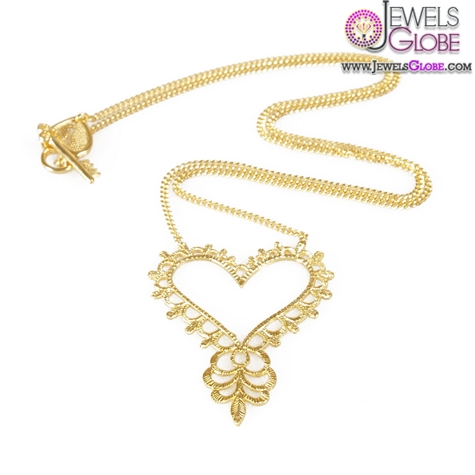 Beautiful feminine piece with hand carved heart pendant and swirl design