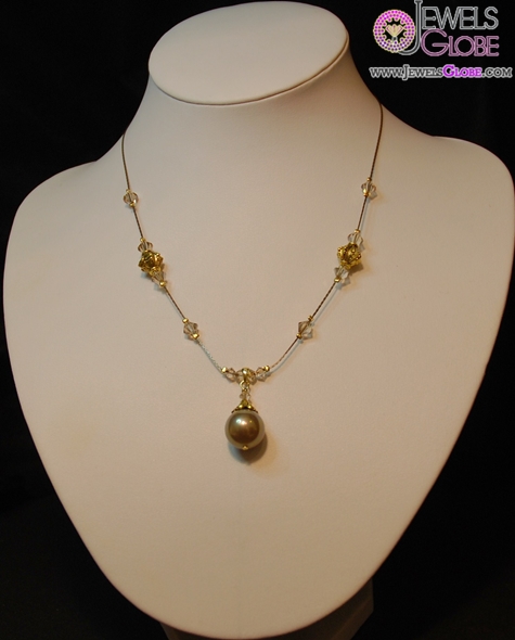 Delicate light brown shell based pearl necklace on antique gold chain