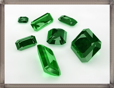 Green Emerald loose gemstones. Numerous cuts and sizes